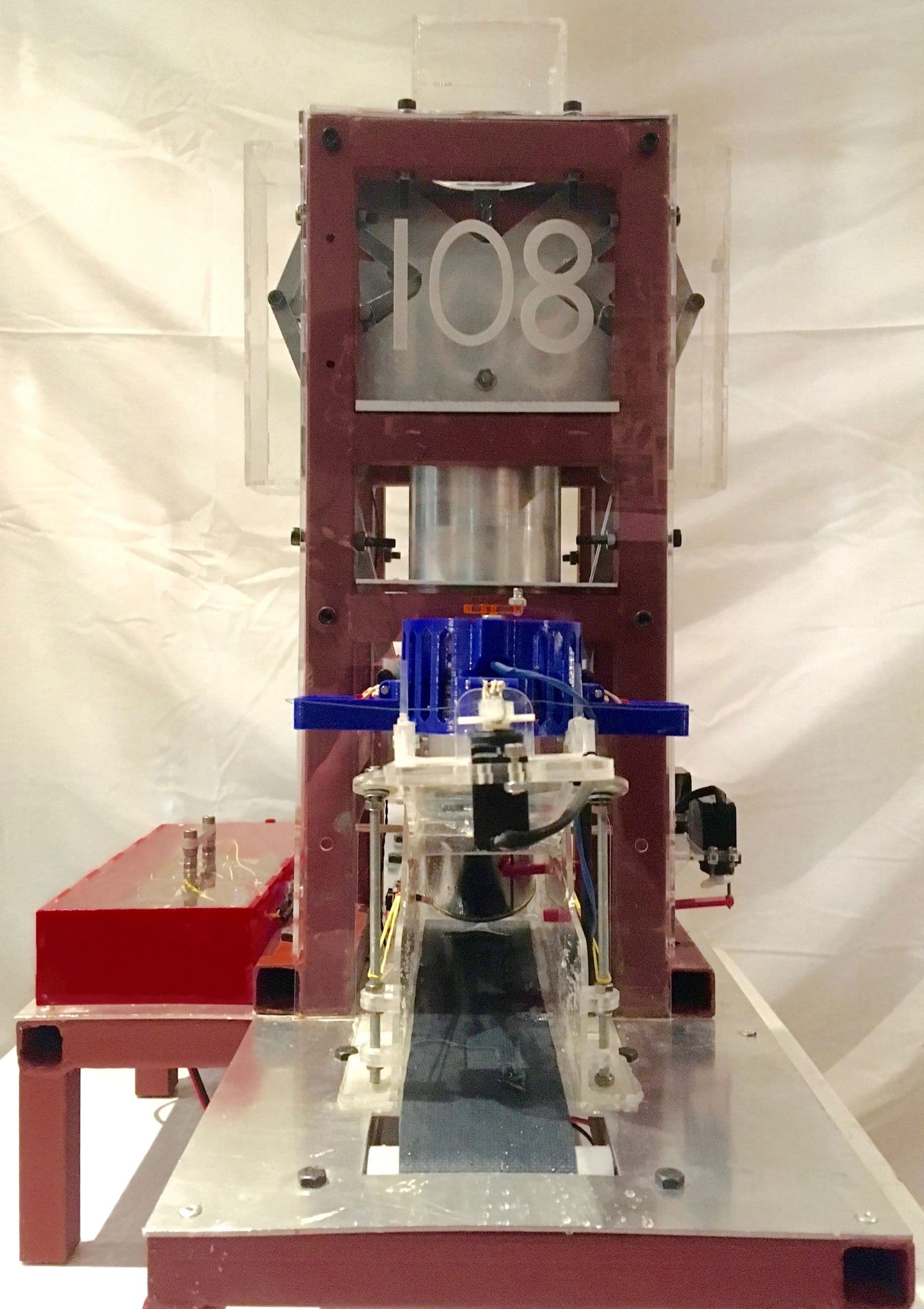 Front close-up of the automated paint jar filling machine