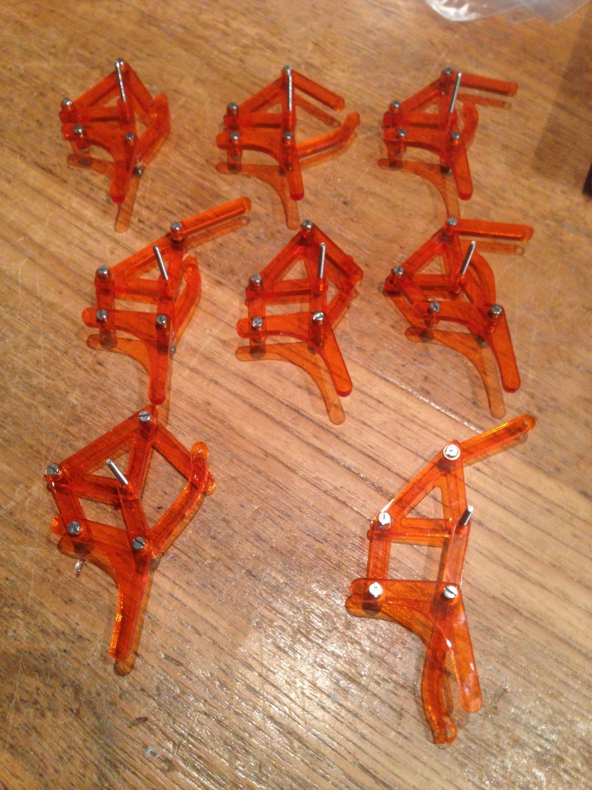 Orange acrylic leg assemblies laid out